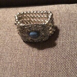 Intricate Silver and Blue Gemstone Bracelet